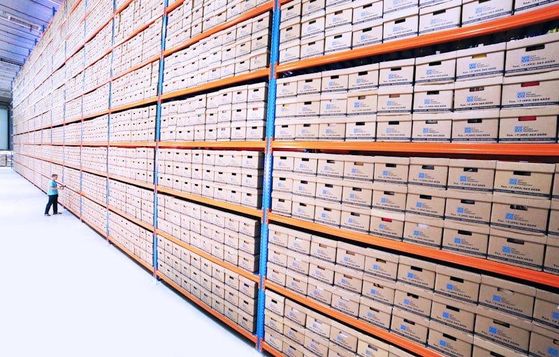 Warehouse shelving stacked with boxed stock